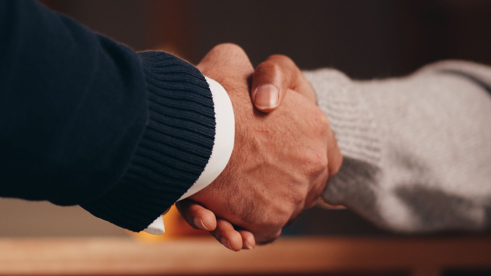 Two business people shaking hands after reaching an agreement.