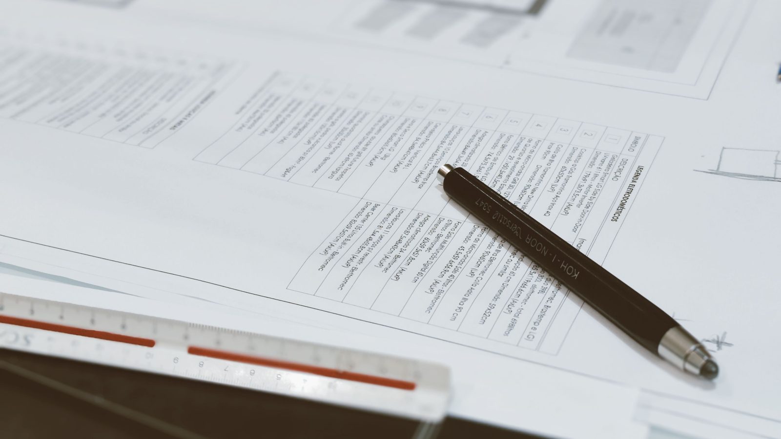 Technical plans and a pencil laid out for detailed contingency planning.